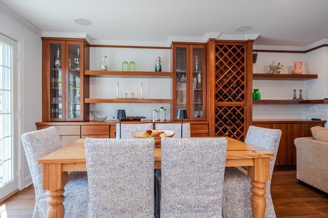 bar featuring wood finished floors and crown molding
