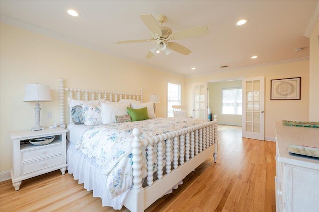 bedroom featuring light wood-type flooring, recessed lighting, ornamental molding, and baseboards