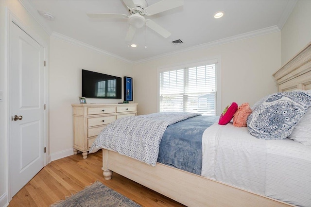 bedroom featuring crown molding, recessed lighting, visible vents, and light wood-type flooring