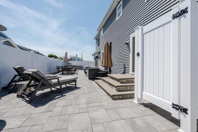 view of patio with outdoor lounge area, outdoor dining area, and a fenced backyard
