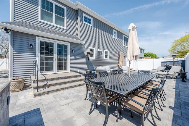 view of patio / terrace featuring fence and entry steps