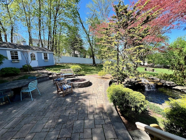 21 Rhinecliff Rd, Brewster, NY 10509 - view of patio / terrace with fence, an outdoor structure, and an outdoor fire pit