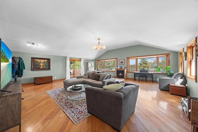 21 Rhinecliff Rd, Brewster, NY 10509 - living room with light wood-style floors, a chandelier, and vaulted ceiling