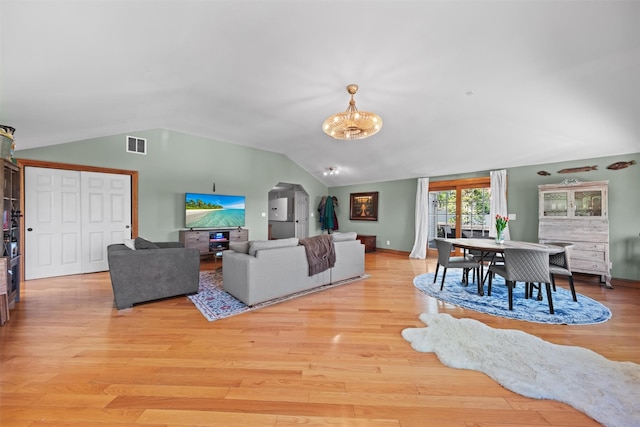 21 Rhinecliff Rd, Brewster, NY 10509 - living area with visible vents, light wood-style flooring, a chandelier, and vaulted ceiling
