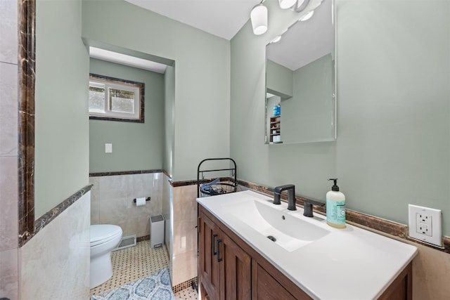 21 Rhinecliff Rd, Brewster, NY 10509 - bathroom featuring toilet, tile walls, wainscoting, and vanity