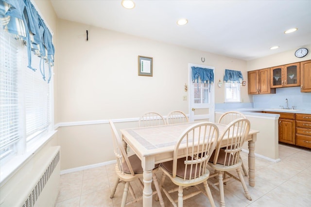 dining area featuring recessed lighting, radiator, and light tile patterned flooring