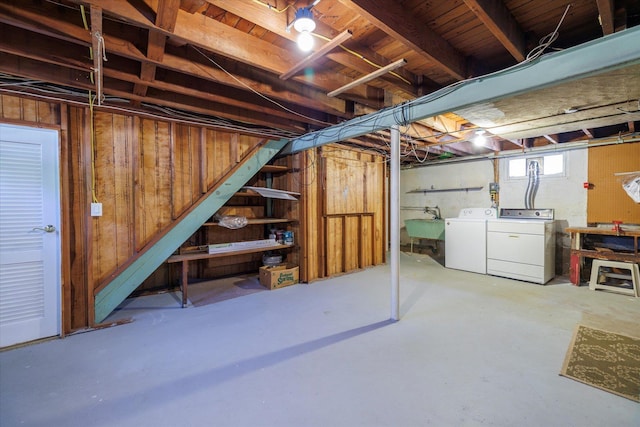 below grade area with a sink and independent washer and dryer