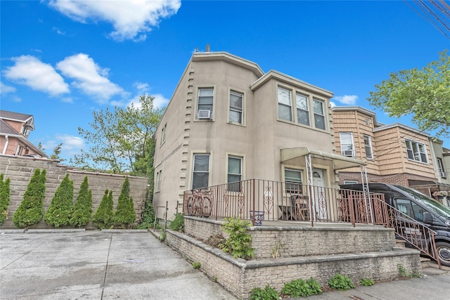 13-32 130th St, College Point, NY 11356 - view of property with stucco siding