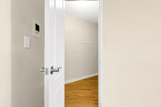 corridor with wood finished floors