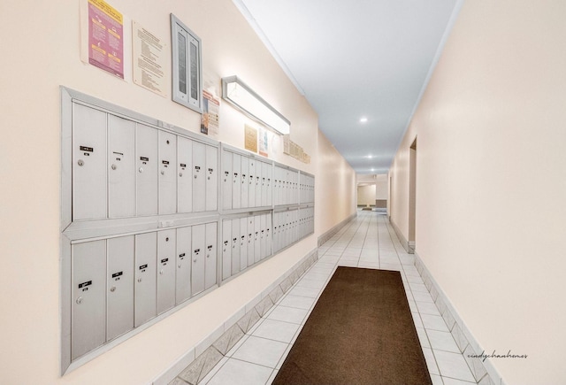 corridor featuring recessed lighting, mail area, and tile patterned floors