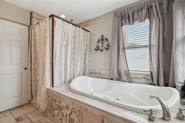 bathroom featuring a garden tub