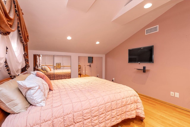 427 Wanamaker St, Oceanside, NY 11572 - bedroom with recessed lighting, two closets, light wood-type flooring, visible vents, and vaulted ceiling