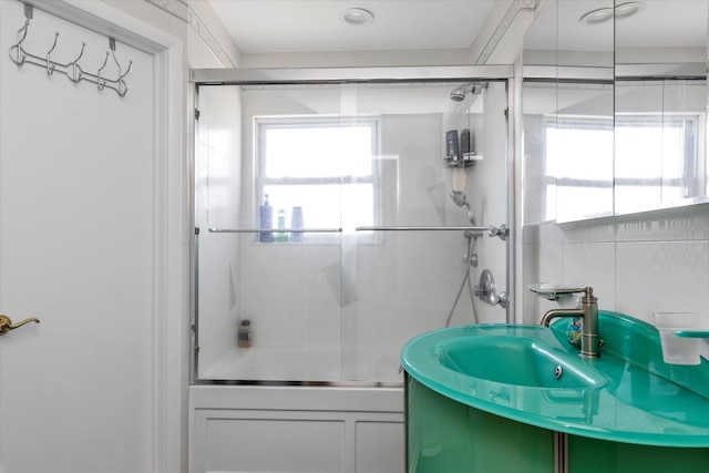 427 Wanamaker St, Oceanside, NY 11572 - full bathroom featuring vanity and shower / bath combination with glass door