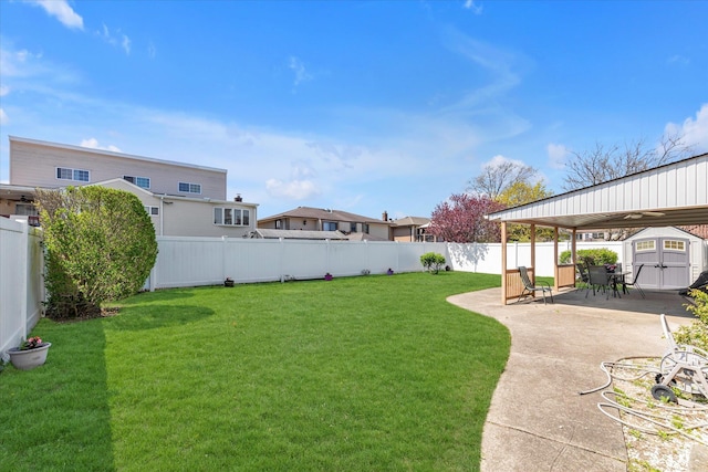 427 Wanamaker St, Oceanside, NY 11572 - view of yard featuring a fenced backyard, a shed, an outbuilding, and a patio area