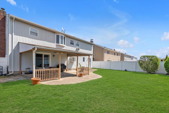 427 Wanamaker St, Oceanside, NY 11572 - rear view of house featuring cooling unit, a yard, a fenced backyard, and a patio area