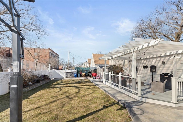 view of yard featuring a pergola, a fenced backyard, and a deck