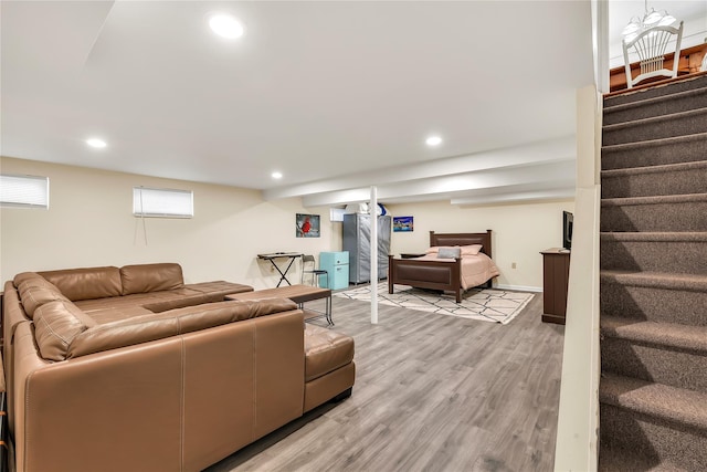 living area with recessed lighting, light wood-type flooring, and stairs