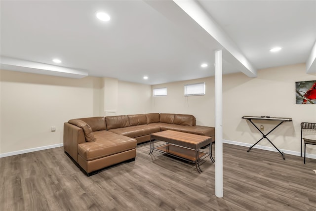 living area featuring recessed lighting, baseboards, and wood finished floors
