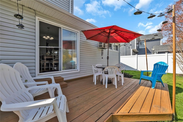 deck with fence and outdoor dining area