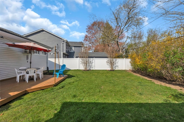 view of yard featuring fence and a deck