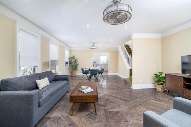 living room with baseboards, ornamental molding, stairs, and recessed lighting