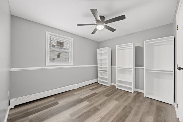 42 Horton Rd, Washingtonville, NY 10992 - unfurnished bedroom featuring wood finished floors, baseboards, and ceiling fan