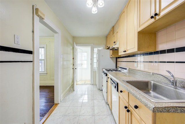 32-55 54th St, Woodside, NY 11377 - kitchen featuring a sink, light brown cabinetry, gas range gas stove, dishwasher, and light countertops