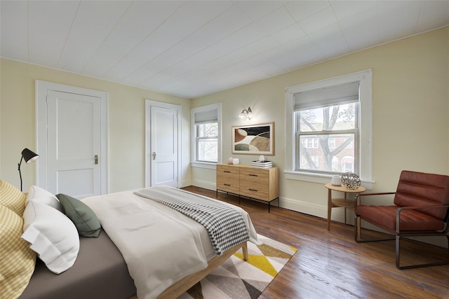 32-55 54th St, Woodside, NY 11377 - bedroom featuring dark wood-style floors and baseboards