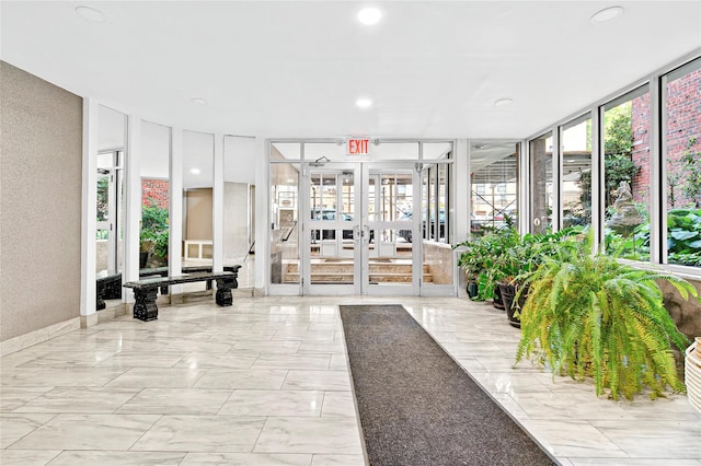 lobby with a wall of windows and recessed lighting