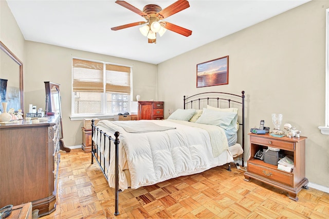 bedroom with baseboards and ceiling fan