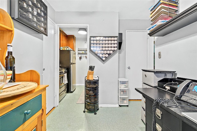 home office featuring baseboards and light floors