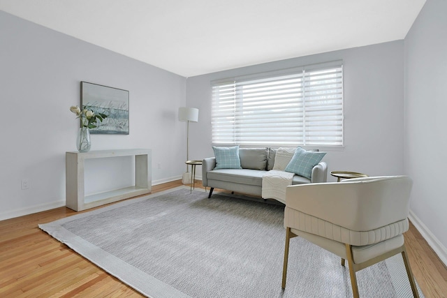 interior space featuring baseboards and wood finished floors
