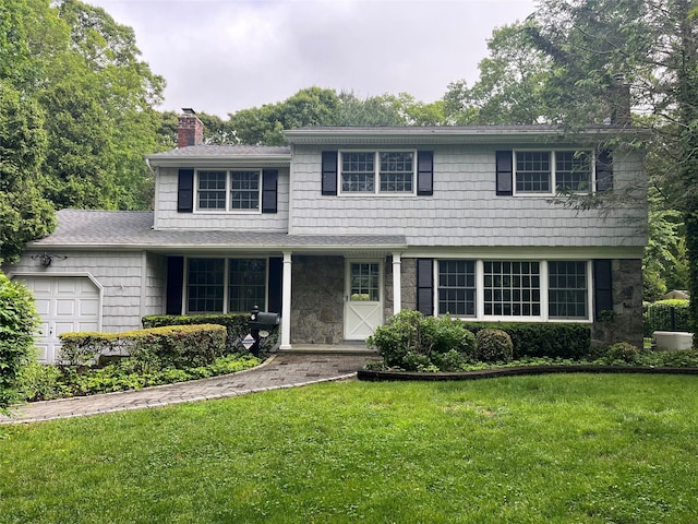 6 Rice Ln, Smithtown, NY 11787 - view of front facade featuring a chimney, an attached garage, a front lawn, and stone siding