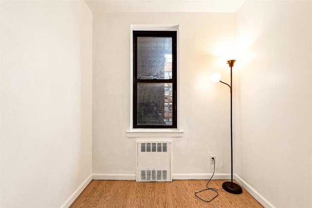 105-15 66th Rd St Unit 4E, Forest Hills, NY 11375 - unfurnished room featuring radiator, baseboards, and light wood-type flooring