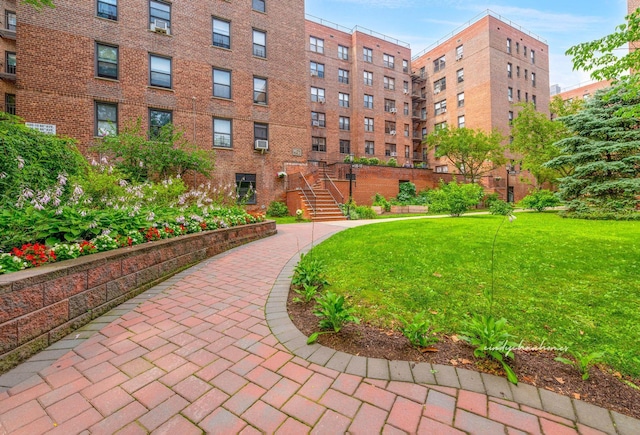105-15 66th Rd St Unit 4E, Forest Hills, NY 11375 - view of community featuring a lawn