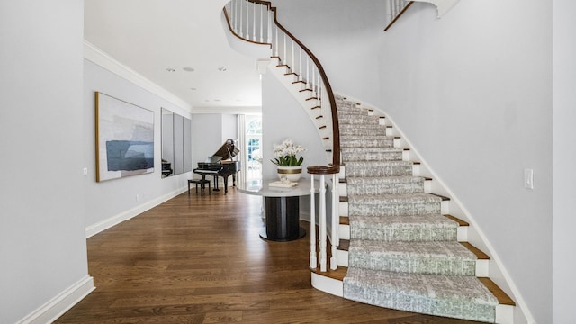 3 Pin Oak Ct, Old Brookville, NY 11545 - stairs featuring wood finished floors, crown molding, and baseboards