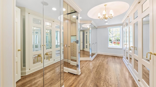3 Pin Oak Ct, Old Brookville, NY 11545 - entryway with french doors, a chandelier, wood finished floors, crown molding, and recessed lighting