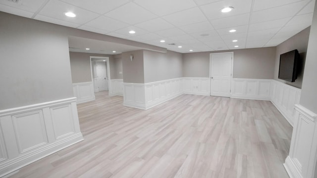 3 Pin Oak Ct, Old Brookville, NY 11545 - spare room featuring a wainscoted wall, a paneled ceiling, a decorative wall, light wood-style floors, and recessed lighting