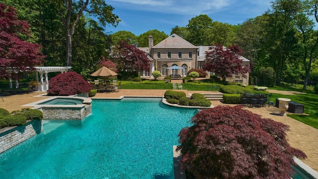 3 Pin Oak Ct, Old Brookville, NY 11545 - view of pool featuring a pergola, a patio, outdoor dining space, and a pool with connected hot tub