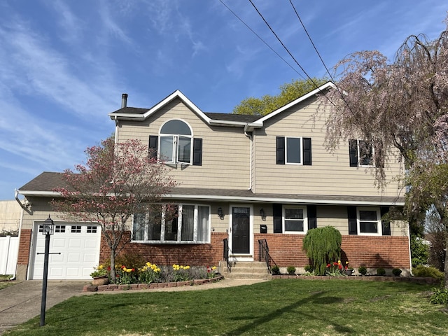 traditional-style home with roof with shingles, concrete driveway, brick siding, a garage, and a front yard