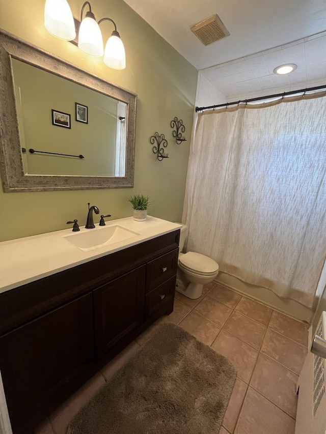 bathroom with tile patterned floors, vanity, curtained shower, toilet, and visible vents