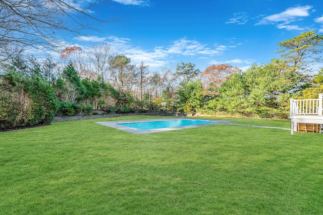 pool featuring a lawn and a deck