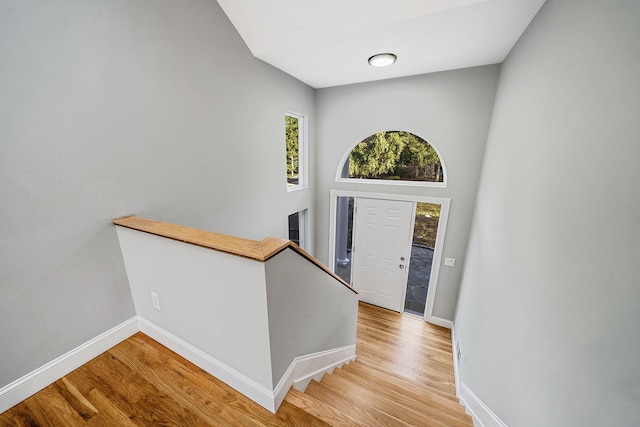 entryway featuring baseboards and light wood-type flooring
