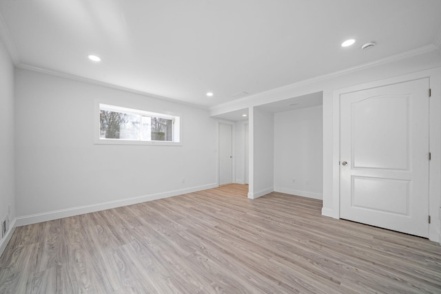 basement featuring recessed lighting, light wood finished floors, baseboards, and ornamental molding