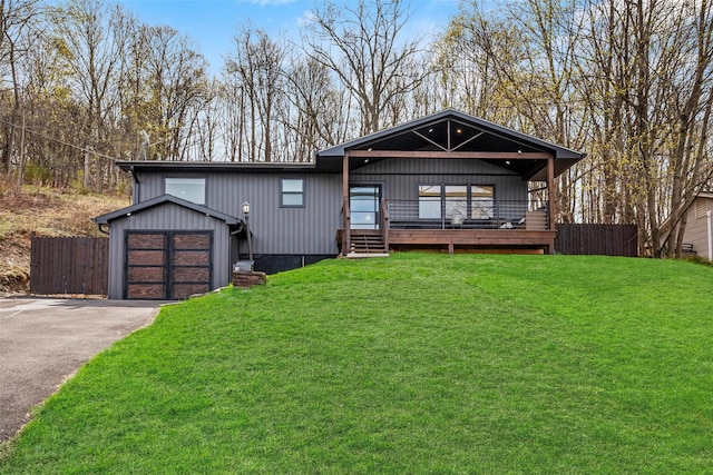 18 Mcbride Pl, Goshen, NY 10924 - view of front of house with asphalt driveway and a garage