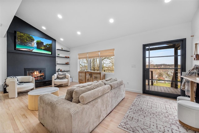 18 Mcbride Pl, Goshen, NY 10924 - living room with a large fireplace, light wood-style flooring, recessed lighting, and high vaulted ceiling