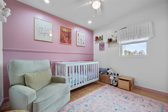 18 Mcbride Pl, Goshen, NY 10924 - bedroom featuring recessed lighting, wood finished floors, a ceiling fan, and a crib