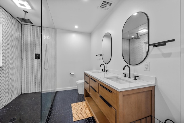 18 Mcbride Pl, Goshen, NY 10924 - bathroom featuring double vanity, tiled shower, tile patterned floors, and recessed lighting