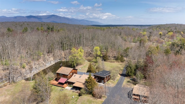 aerial view with a forest view and a mountain view