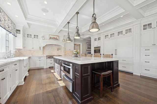 kitchen featuring white cabinetry, dark wood-style floors, a breakfast bar, and oven